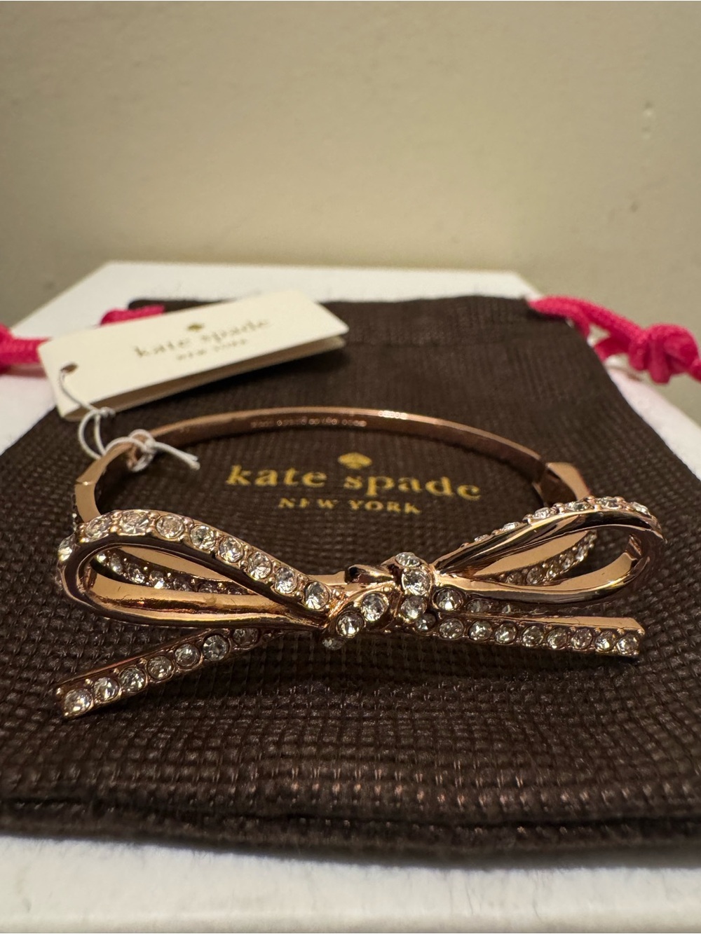 NWT Kate Spade Skinny Mini Pave Bow Bangle Bracelet Rose Gold with Pouch